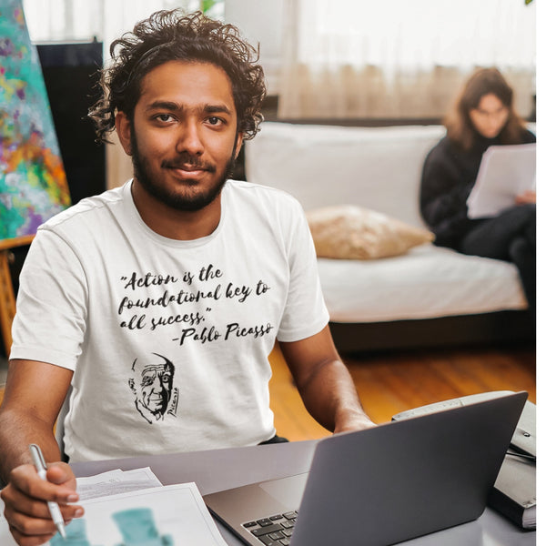 Action is the Foundational Key to Success Pablo Picasso White T-Shirt smile with pencil on hand laptop on desk